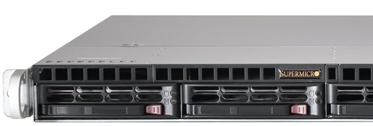 Front view of a 1U Supermicro rackmount server chassis with four hot-swappable drive bays and ventilation slots.